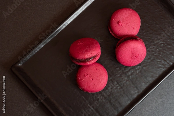 Obraz Raspberry macarons on a slate plate