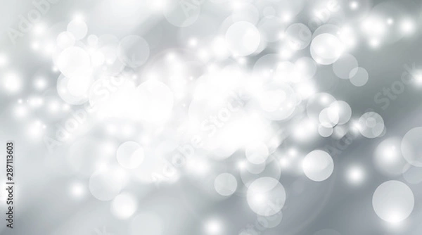 Fototapeta white and gray snow blur abstract background. Grey Bokeh Christmas blurred beautiful shiny Christmas lights