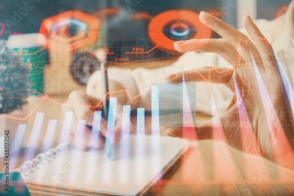 Fototapeta Forex chart displayed on woman's hand taking notes background. Concept of research. Multi exposure