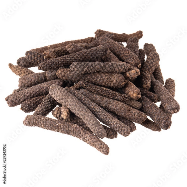 Fototapeta heap of pippali (long pepper) isolated on white background. top view