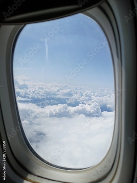 Fototapeta Cotton clouds from the plane's eiumator