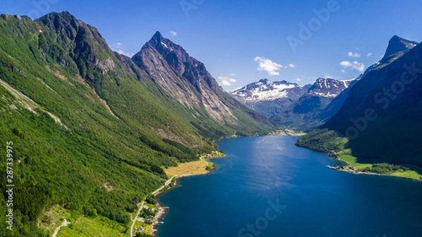 Fototapeta Aerial view on Geiranger fjord in More og Romsdal county in Norway famous for his beautiful boattrip through the fjord.
