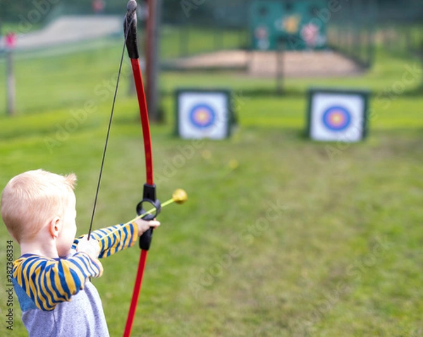 Obraz archer aiming with bow and arrow