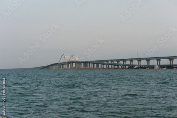 Fototapeta Bridge from mainland russia to the crimean peninsula, the bridge can be used by car and train and can be passed at the chain bridge part