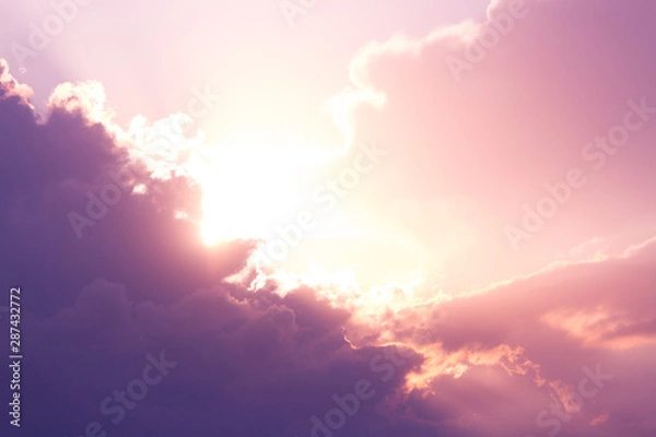 Fototapeta sun rays behind clounds