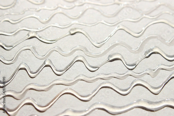 Fototapeta Abstract blurred texture background.  Strange wavy texture. Wavy lines of rubber glue.