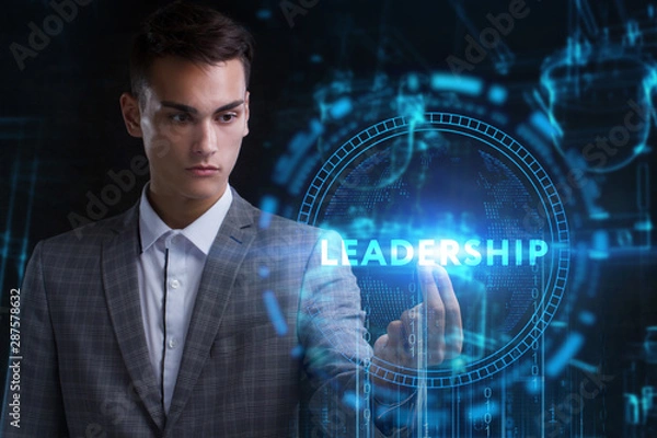 Fototapeta The concept of business, technology, the Internet and the network. A young entrepreneur working on a virtual screen of the future and sees the inscription: Leadership
