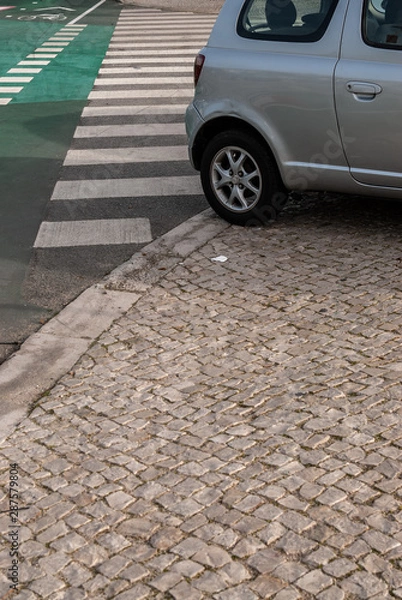 Obraz Car badly parked over de sidewalk and pedestrian crossing