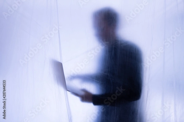 Fototapeta Hacker commits computer crime