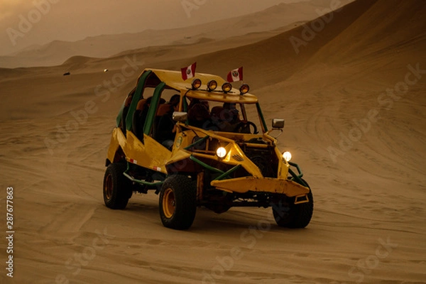 Fototapeta Huacachina a world with buggy desert oasis and dunes of Peru