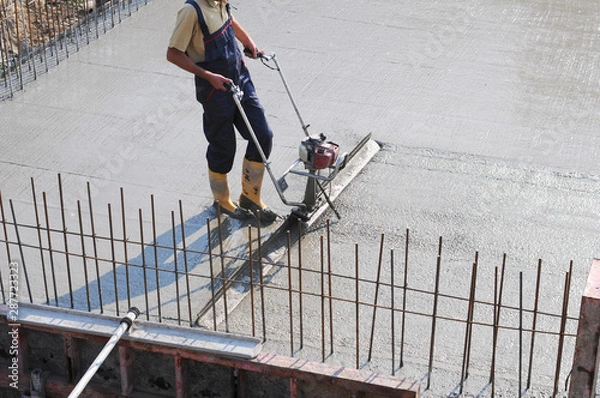 Obraz Concrete pouring during commercial concreting floors of buildings in construction