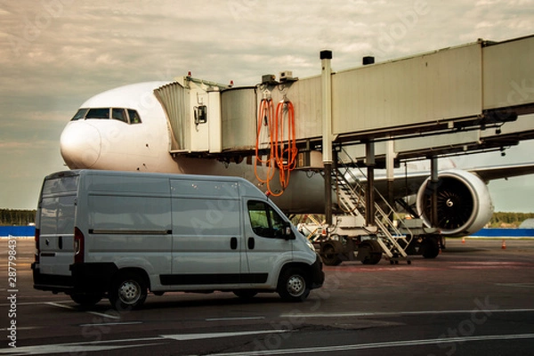 Fototapeta Teletrap connected to the aircraft. The telescopic ladder is connected to aircraft. Boarding and disembarking passengers from an airplane. The sleeve is connected to the aircraft.