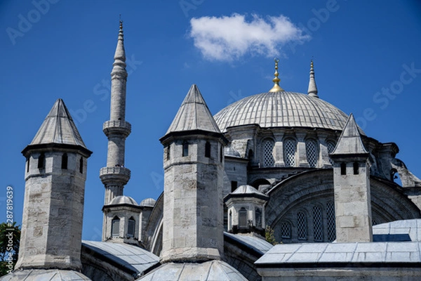 Fototapeta Mosque and minaret in front of blue sky