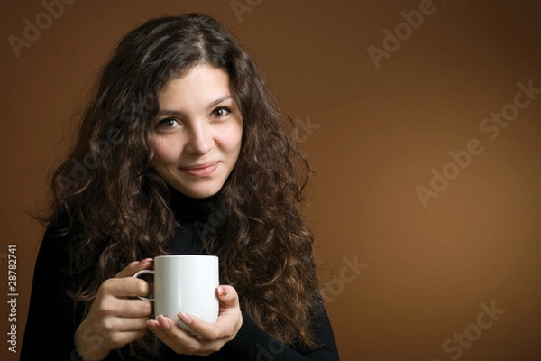Obraz Young woman with cup of hot drink
