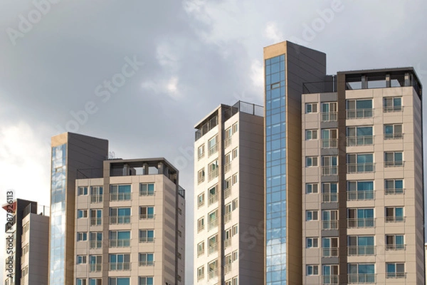 Fototapeta Multistory new modern apartment building