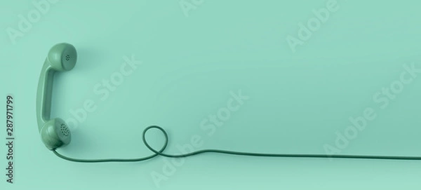 Obraz Zielona słuchawka telefoniczna rocznika wybierania z zielonym tłem.