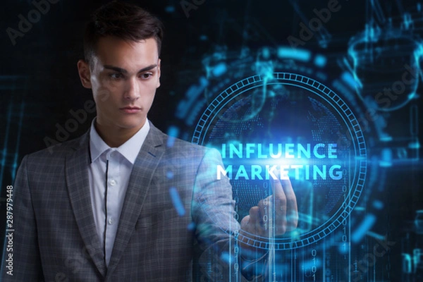Fototapeta The concept of business, technology, the Internet and the network. A young entrepreneur working on a virtual screen of the future and sees the inscription: Influence marketing