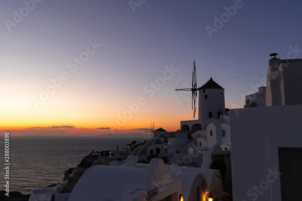 Fototapeta old windmill at sunset