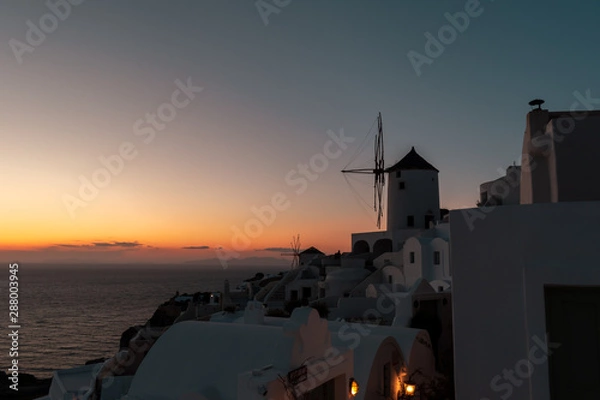 Fototapeta old windmill at sunset