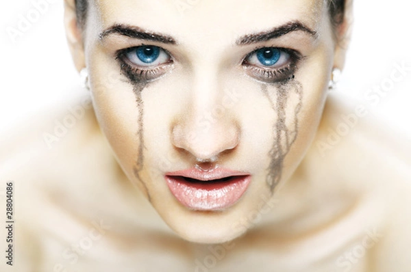 Fototapeta Portrait of the crying girl in light tones