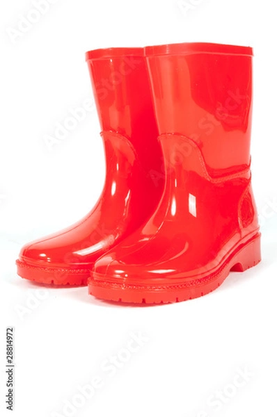 Fototapeta A pair of red rainboots on a white background