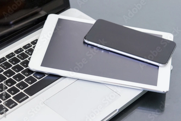 Fototapeta laptop computer and digital tablet on table