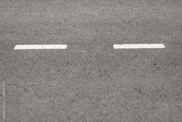 Fototapeta New asphalt texture with white dashed line