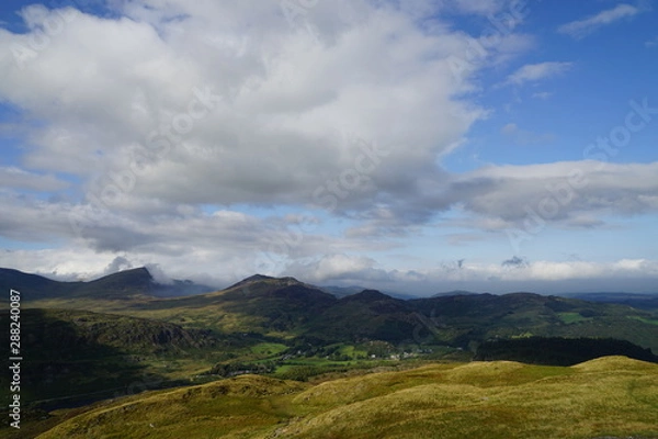 Fototapeta Mountains and Sky with Clouds 