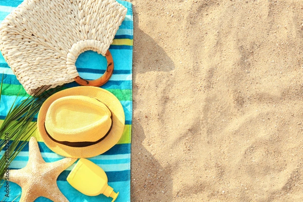 Fototapeta Composition with beach accessories on sand, flat lay. Space for text