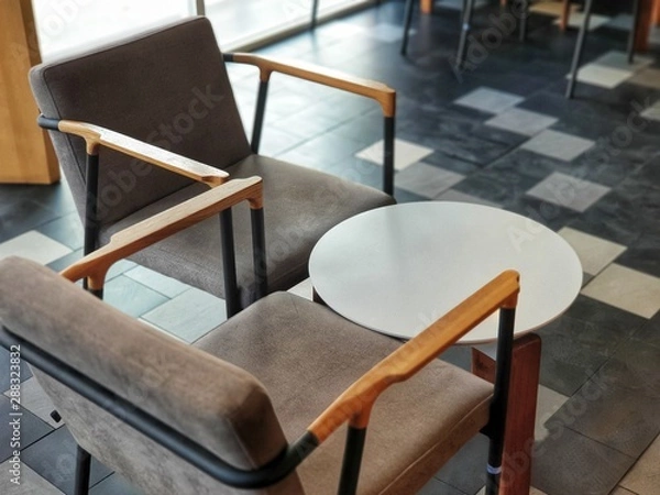Fototapeta Chairs and round table in the empty coffee shop