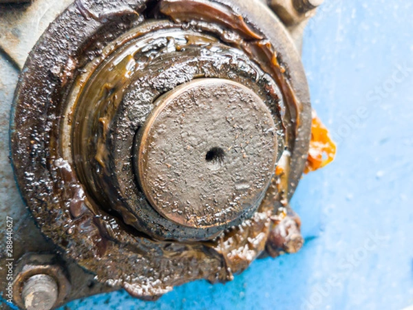 Fototapeta close up bearing support of machine with dirty grease