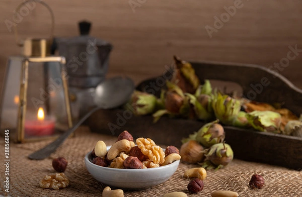 Fototapeta Variation of nuts on a autumn background