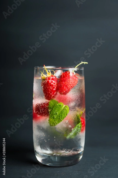 Fototapeta Raspberry mojito cocktail on the rustic background. Selective focus. Shallow depth of field.