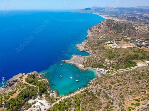 Fototapeta Aerial birds eye view drone photo Ladiko bay near Anthony Quinn on Rhodes island, Dodecanese, Greece. Panorama with nice lagoon and clear blue water. Famous tourist destination in South Europe
