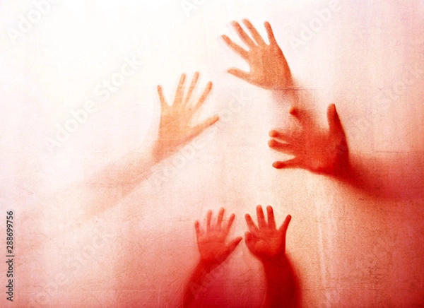 Fototapeta Abstract  shadow of arms and hands  behind red color glass,concept of attacking fear