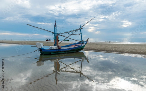 Obraz Small fishing boats parked on the beach.