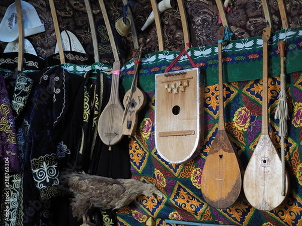 Fototapeta Dombra string instruments on the wall of Kazakh yurt