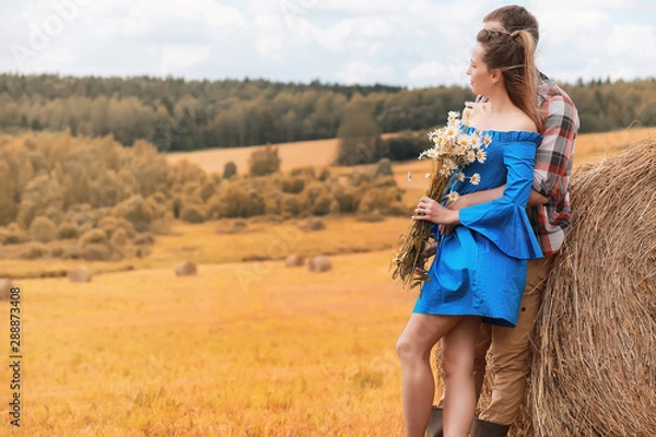Fototapeta Couple on a walk in the country fields