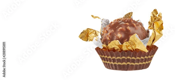 Fototapeta Beautiful chocolate candy ball shape in an open gold wrapper isolated on white with shadows and copy space for your text. Full sharpness across the entire frame field.
