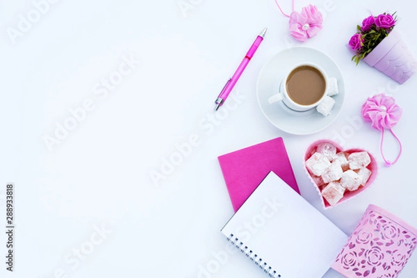 Fototapeta Flat lay girly, pale pink items for planning, notepads, pens, office work or working at home on her laptop, on the pale white background, with place for labels. Concept Desk.