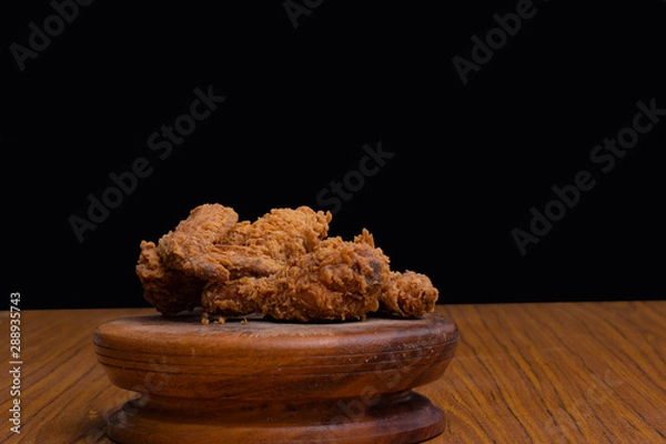 Obraz Delicious crispy fried chicken on black background