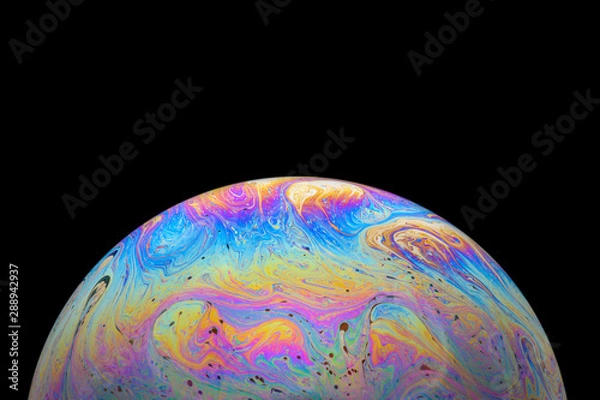 Fototapeta Abstract Soap bubble macro photo with black background look like planet