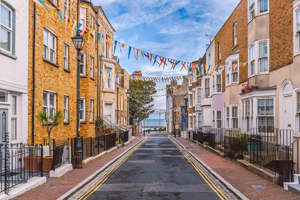 Fototapeta A view along Addington Street, Ramsgate toward the sea. Bunting is flying in preparation for the annual street fair. The street is part of Ramsgate's burgeoning music and art scene.