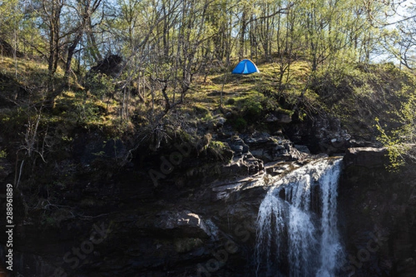 Obraz tent piched at the top of the falls of falloch