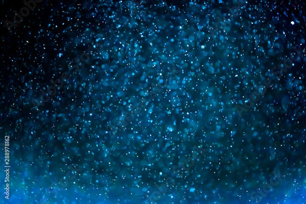 Fototapeta Christmas snow. Christmas and New Year background. Abstract background with luminous snowflakes and sparkles. Christmas concept. Holiday xmas decoration 2020 with snowflakes and glitter. 