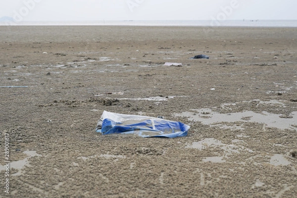 Fototapeta Lok Kawi, Kota Kinabalu, Sabah, Malaysia - September 08, 2019: There is a lot of rubbish left in Lok Kawi Beach. This rubbish are dumped into the sea and washed away to this beach.