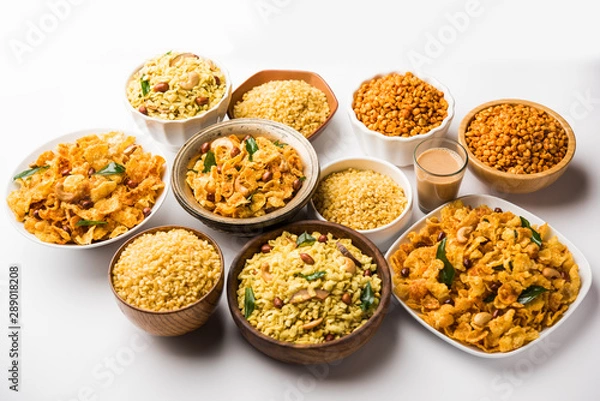 Fototapeta Group of Cornflake and Thick Poha Chivda or Chiwda and Chatpata Masala chana and fried crispy Moong Dal, served in a bowl. selective focus