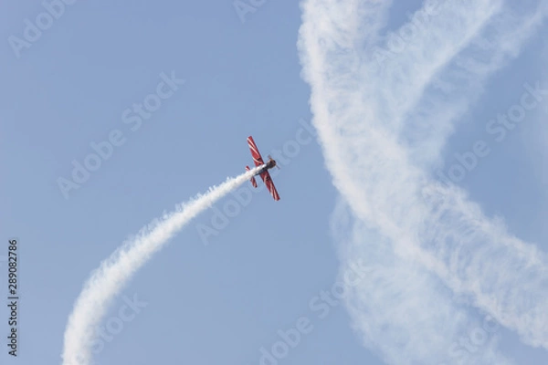 Obraz A front propeller plane flying in the sky