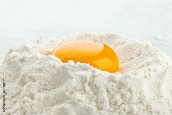 Obraz Broken egg on flour, means for making bread