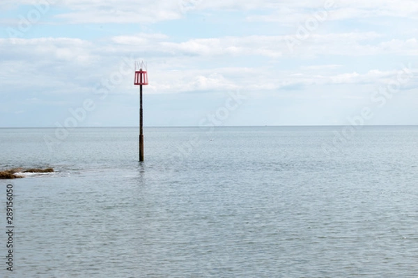 Obraz Post in the sea in Devon, England